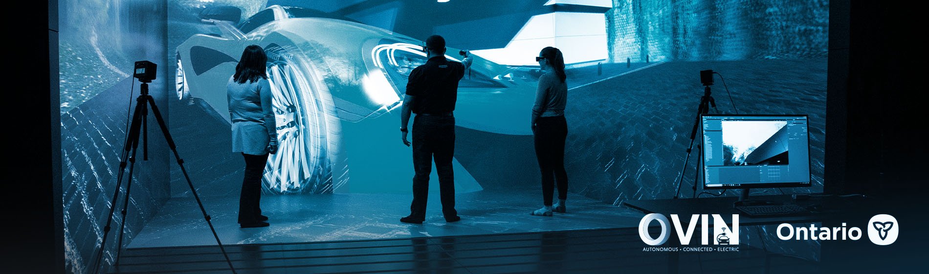 Three people standing in Virtual Reality CAVE